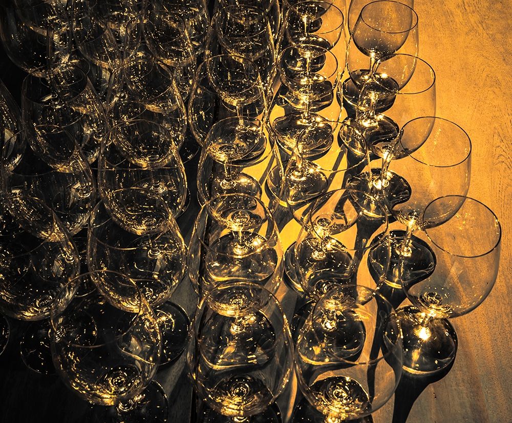 Washington State-Walla Walla Pattern of empty wine glasses in rich sunlight on wooden table